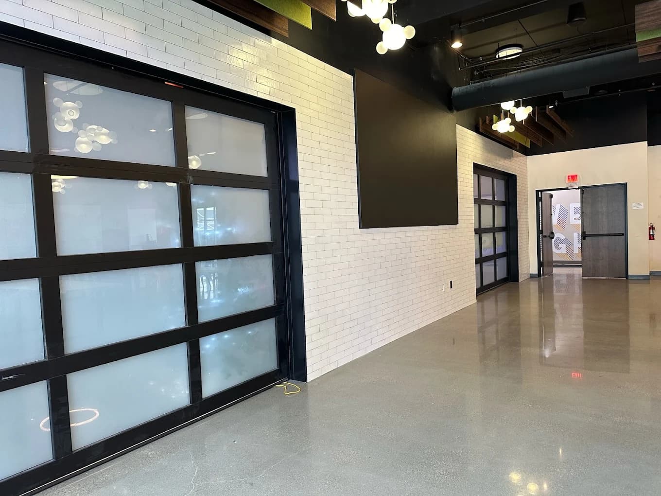 Frosted glass dividing doors and polished concrete floor